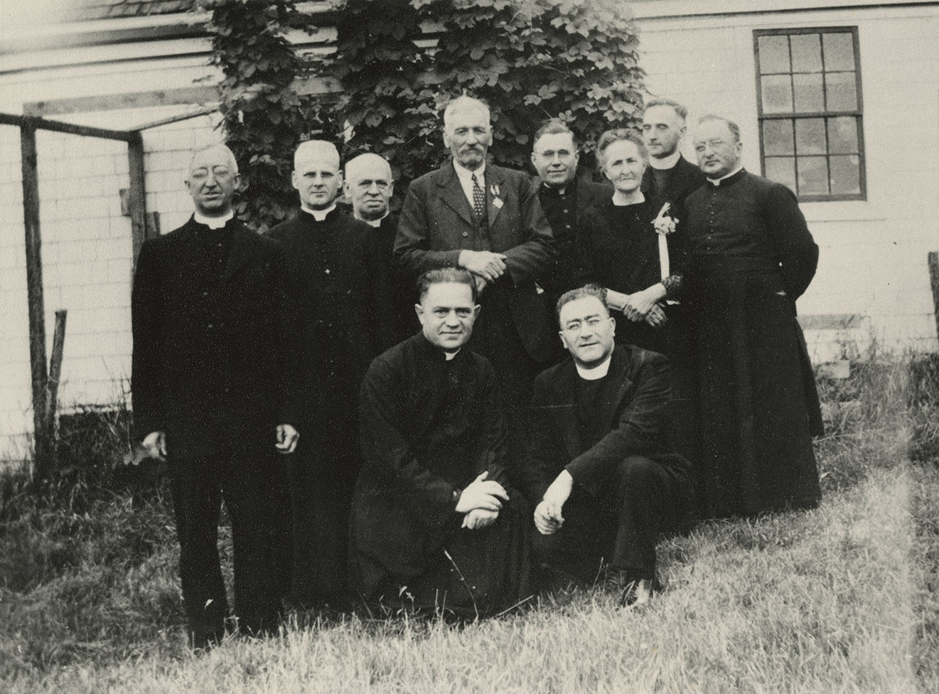 communityalbums - Léo and Marguerite Melanson and priests from College Sainte-Anne