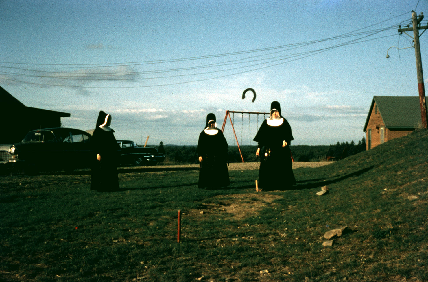 communityalbums - Sisters of Charity-Halifax playing horseshoes, Camp Monte Bello, Yarmouth, Nova Scotia.