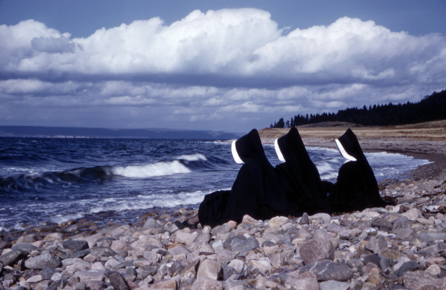 communityalbums - Sisters of Charity-Halifax sitting on rocks overlooking the ocean, Irish Cove, Nova Scotia.