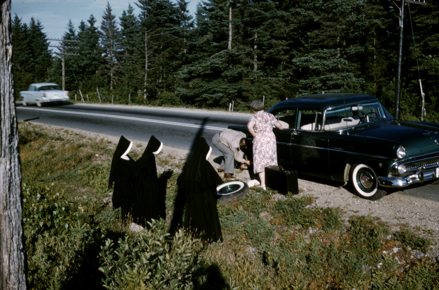 communityalbums - Sisters of Charity-Halifax looking on as a tire is changed on the way to Camp Villa Maria, Mahone Bay, Nova Scotia.