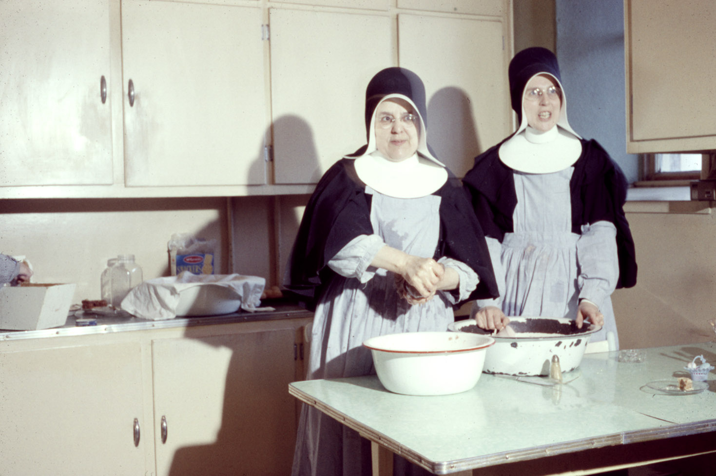 communityalbums - Making rappie pie in the kitchen, Sacred Heart Convent, Meteghan, Nova Scotia.