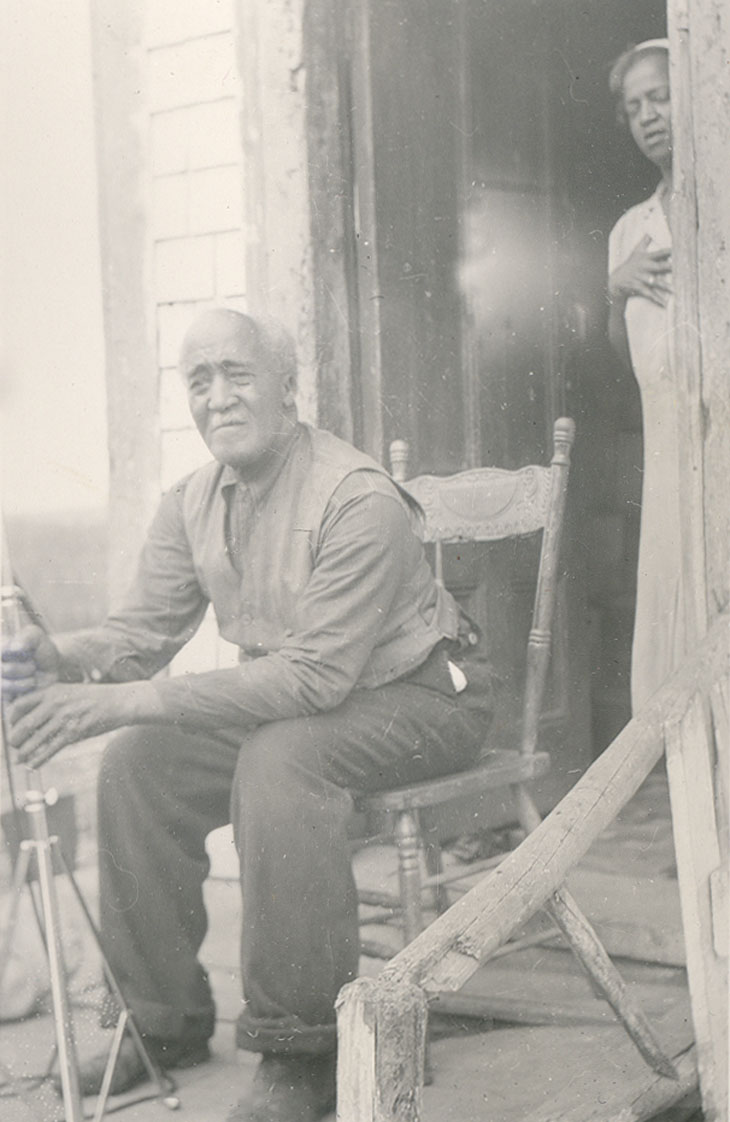 William Riley, with his daughter Rose standing behind him in the doorway, Cherry Brook