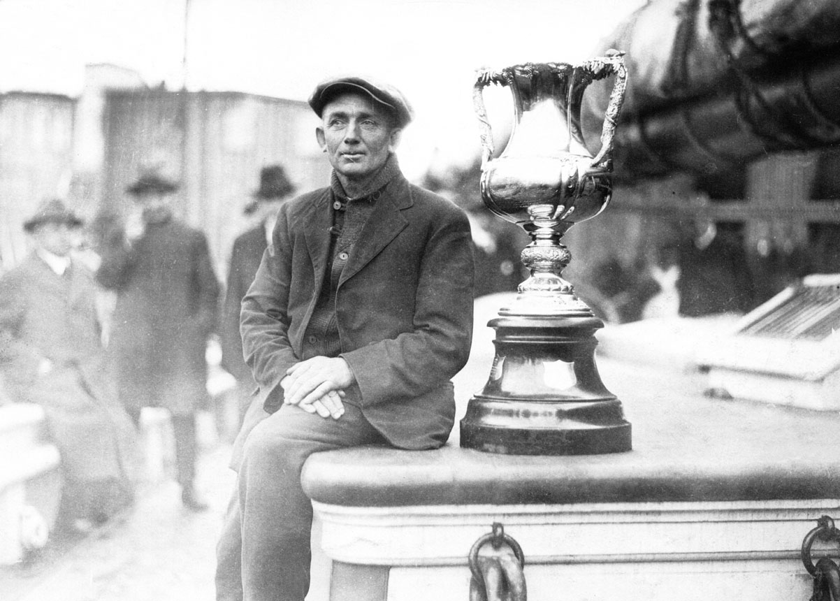 Captain Angus Walters with the International Fishermen's Trophy on the deck of the <i>Bluenose</i>