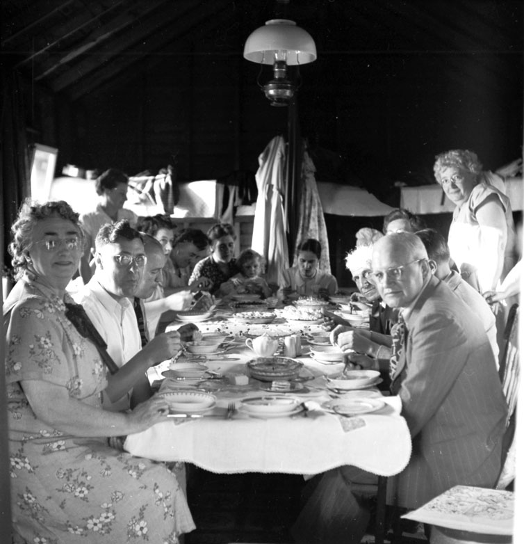 Picnic supper at summer camp in Freeport, a few miles from Grand Passage on the Bay of Fundy. August 1950