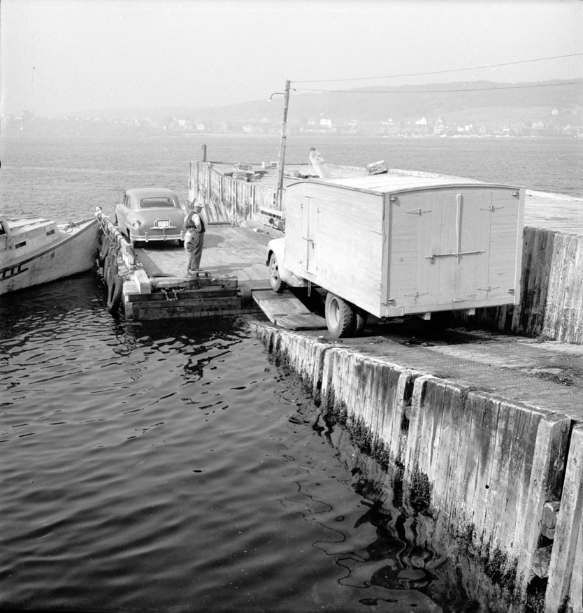 Car ferry to Tiverton. When the water is too rough, only the boat runs, carrying passengers across the Petit Channel. August 1950.
