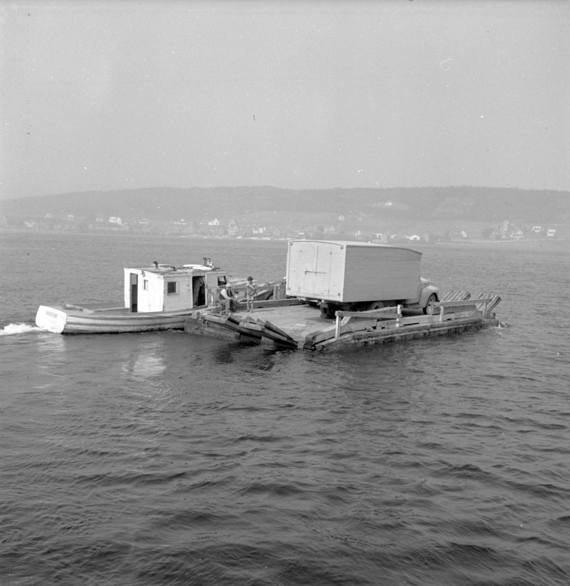 Car ferry to Tiverton. When the water is too rough, only the boat runs, carrying passengers across the Petit Channel. August 1950.