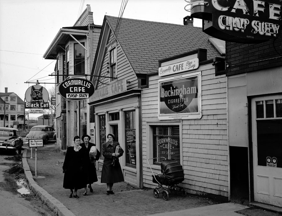 The road to the wharf. The Courier office is just down the street. December 1950.