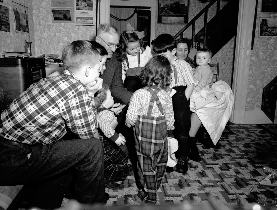 Vian Andrews and his grandchildren, Gail (Dean's son), Maxine (Reggie's daughter) and David (Phyllis's son) on Christmas night. December 1950.
