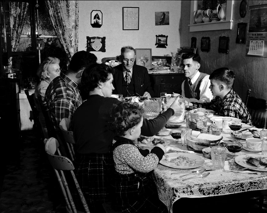 Christmas night dinner at Vian Andrews'. Mr. and Mrs. J. Vian Andrews at head of table; on their right, son Dean and his wife and son Vian; on the left, son John and grandson Harry Thomas. December 1950.