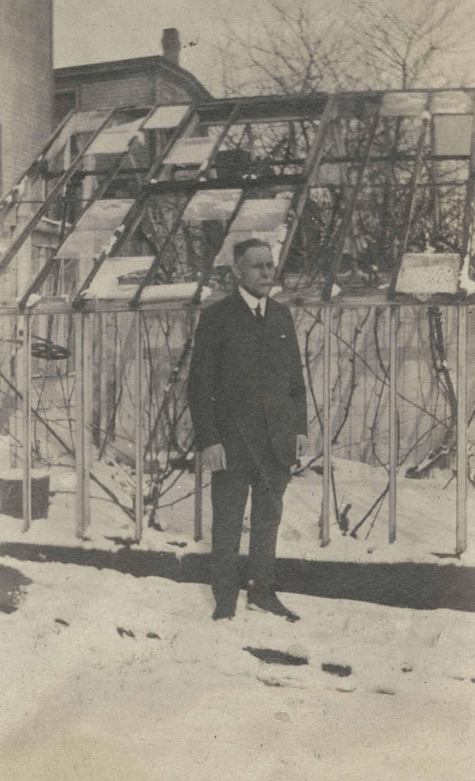 creighton : Father Charles E. Creighton in front of greenhouse after Halifax Explosion, Portland St., Dartmouth