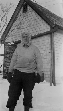 Unidentified man shovelling snow in the country