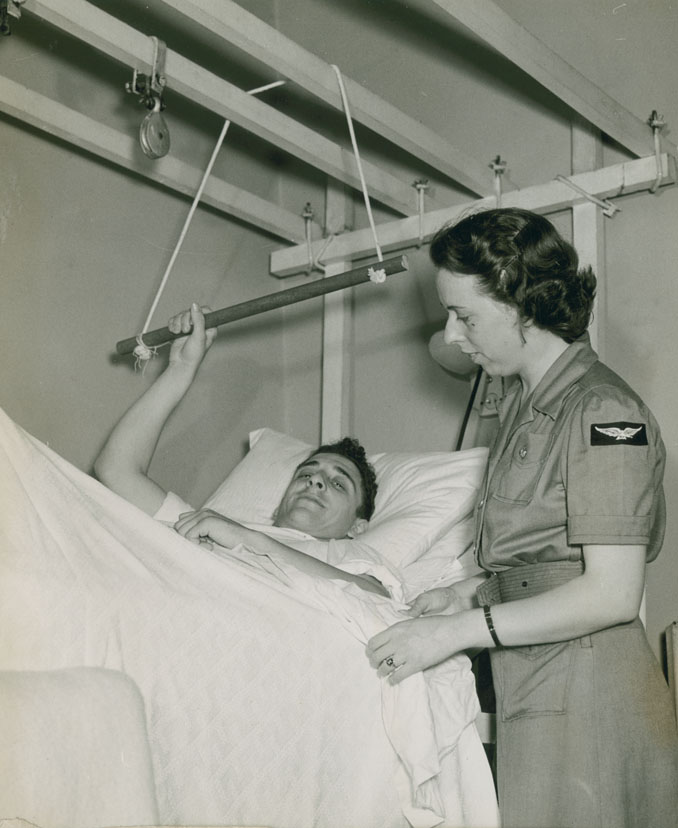 LAC John P. Vezina of Montreal recuperating in the Sick Bay at RCAF Station Dartmouth, with the old Leading Airwoman Nancy Goddess