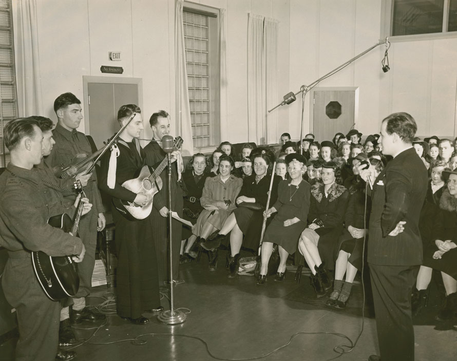 Announcer and performers in the CHNS Tobin Street studio with a large audience