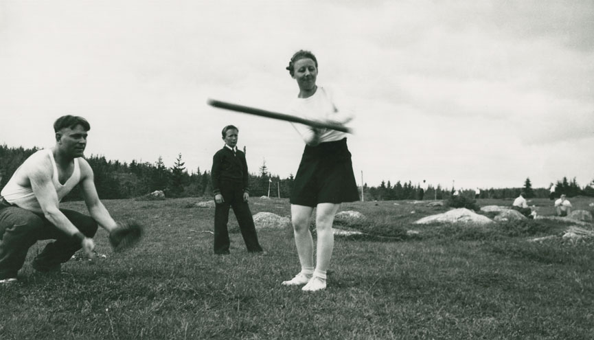 Beryl Backman and Nick O'Neil playing softball