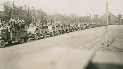 Military troops in trucks brought in to quell the V-E Day Riots