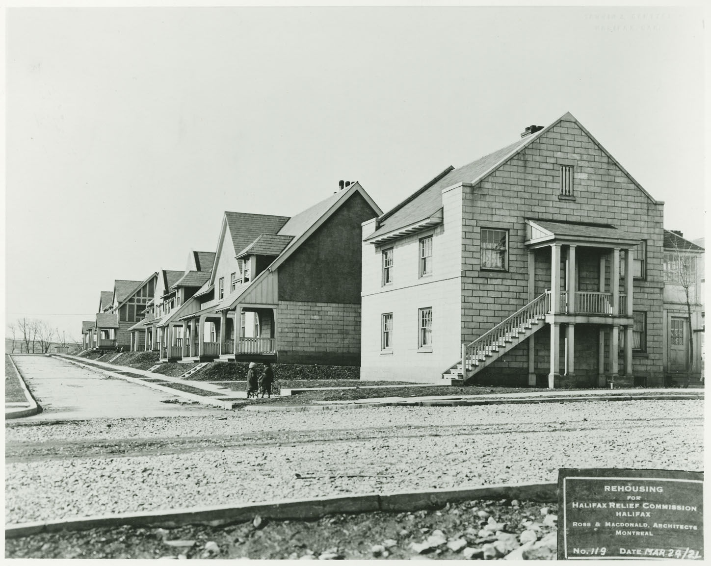 These hydrostone houses are on the north side of Sebastian Place, west of Gottingen Street.  The corner house was Ross & Macdonald design F1.1.  The photograph belonged to William Smith, foreman for Ross & Macdonald.
