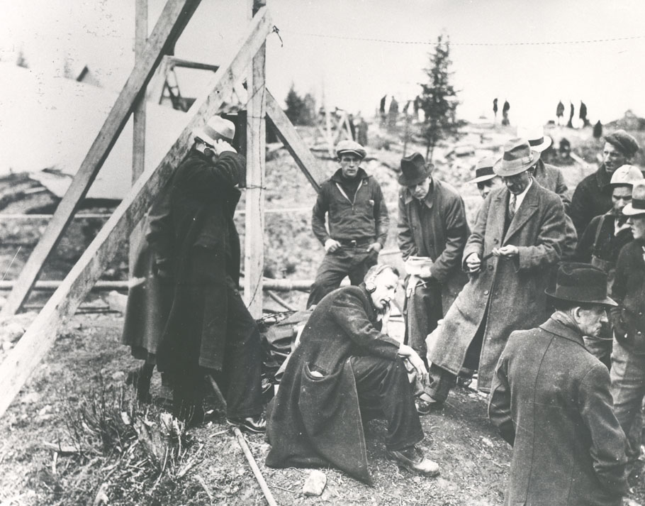 halifax : J. Allister Bowman, district plant superintendent, Maritime Tel & Tel, using earphones for word from entombed men in Moose River Mine Disast