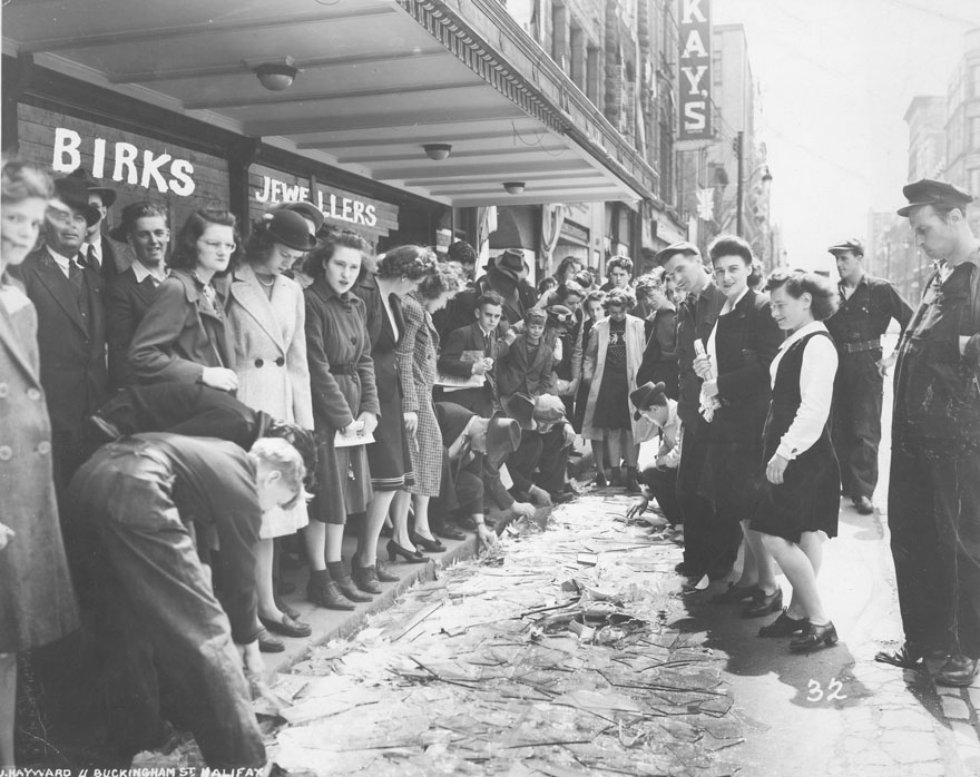 Crowd viewing broken glass outside Henry Birks & Sons Limited, Barrington St., Halifax, after the Bedford Magazine Explosion, 18 July, 1945