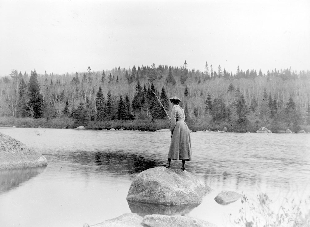 Woman fly-fishing, ca. 1900
