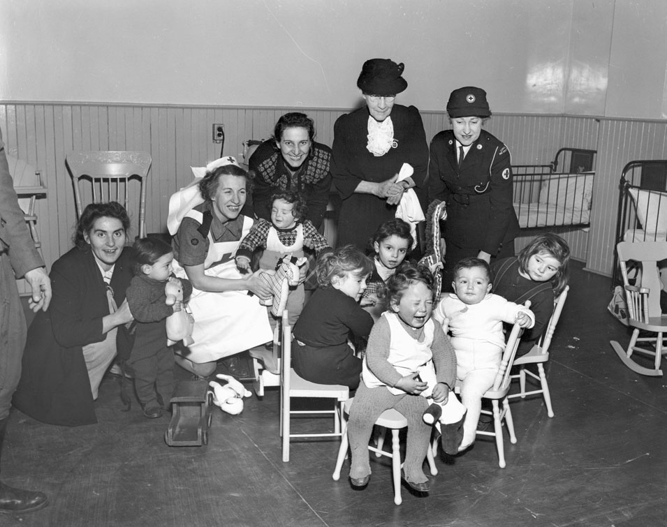Immigrant Children with Red Cross Port Workers, Pier 21, Halifax, 1948