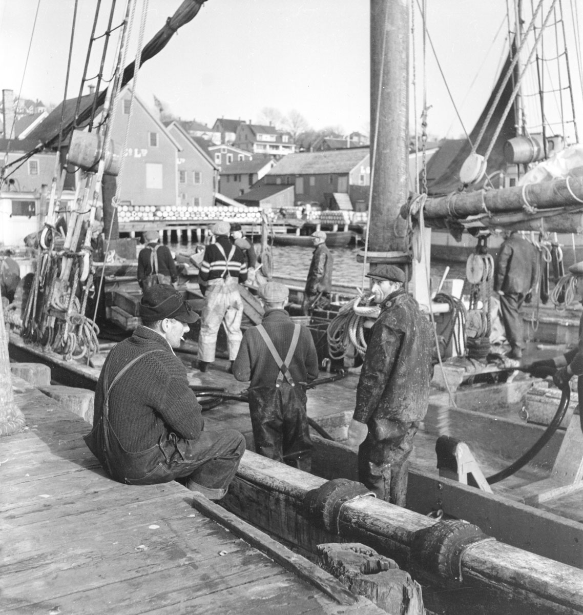 Men on deck at the wharf