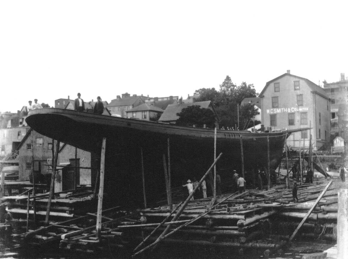 Schooner under construction behind W.C. Smith & Co. Ltd.