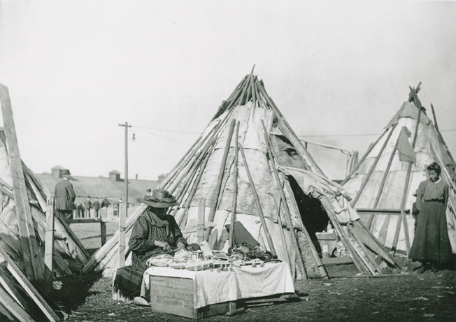 Mi'kmaq women selling beadwork in front of wigwams, Halifax 1906