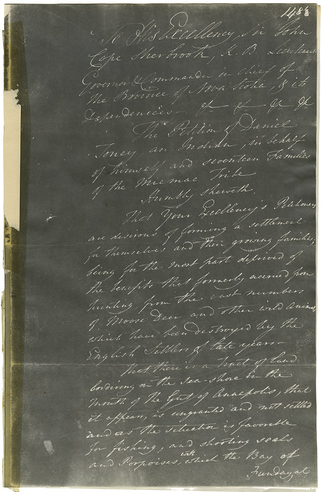 Negative copy of the petition of Daniel Toney on behalf of himself and 17 families of Mi'kmaq. Referred to the Surveyor General and annotated by J.C. S. (John Coape Sherbrooke)